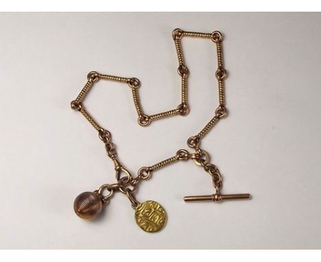 WATCH CHAIN.
A fancy, baton link watch chain with fobs attached.