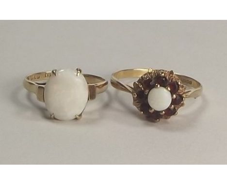 OPAL RINGS.
A 9ct. gold opal & garnet cluster ring & one other 9ct. gold opal ring.