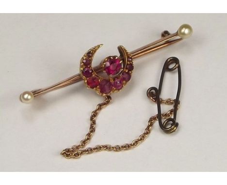 BAR BROOCH.
A late 19th/early 20th century ruby & pearl bar brooch. Length 4.5cm. CONDITION REPORTS: All the rubies are intac