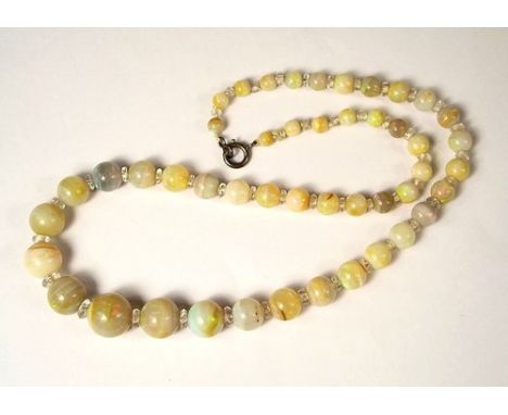 OPAL NECKLACE.
An opal necklace comprising 47 graduated beads, with crystal spacer beads. Smallest bead approx 3mm. Largest b