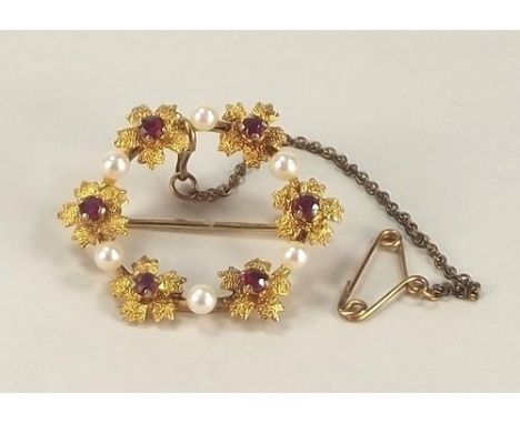 GOLD BROOCH.
A 9ct. gold ruby & pearl brooch.