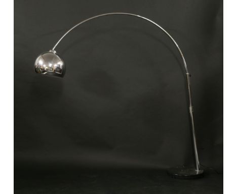 A chrome arc lamp, with a globe shade on a marble plinth