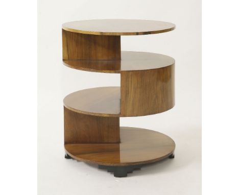 An Art Deco circular walnut three-tier lamp table,with ebonised block feet,64cm high51cm diameter