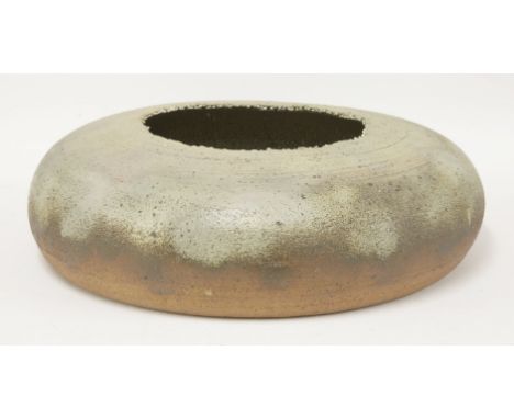 A large stoneware bowl,by Robin Welch (b.1936), with a grey glaze and a rough rim, the interior glazed in grey-green with two
