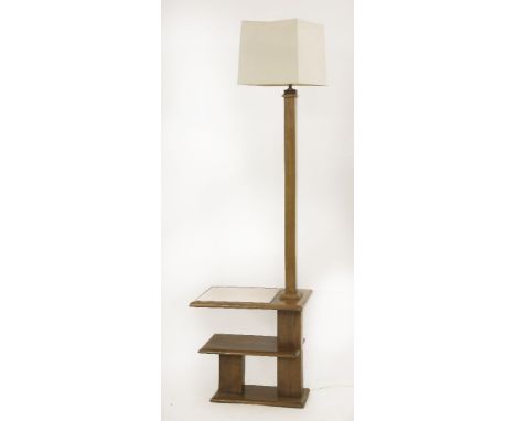 An Art Deco walnut two-tier lamp standard,the top with a bevelled glass pink-tinted top, with a modern shade,164cm high