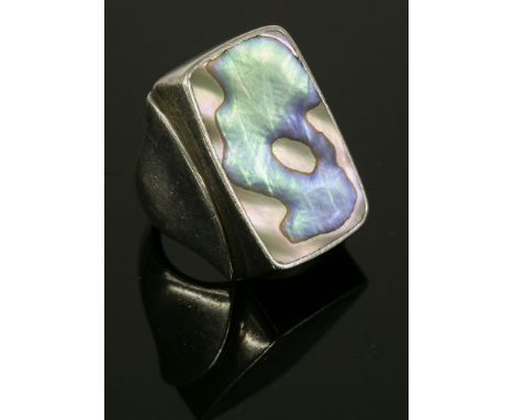 A sterling silver abalone ring, c.1960,by Palle Bisgaard, with an abalone slice, rub set to a cushion-shaped rectangular head