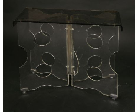 A Lucite side table,1970s, the 'X' shaped base fitted with a light,76cm wide34cm deep62.5cm high