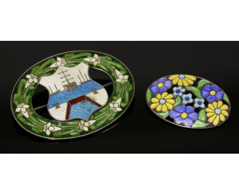 A sterling silver oval brooch,with an applied shield centre with polychrome enamel depiction of ships in a port, with an enam