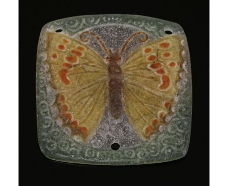 An Art Nouveau pâte-de-verre glass pendant,by Gabriel Argy-Rousseau, depicting a butterfly in yellow and orange to a central 