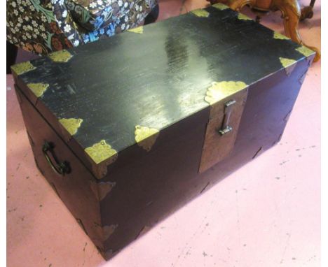 TRUNK, late 19th century Korean ebonised and brass bound with carrying handles, 83cm W x 42cm H x 45cm D. (with faults)