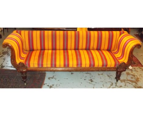 SOFA, William IV mahogany with carved over scrolled arms in orange and red striped upholstery, 235cm W. (re upholstery requir