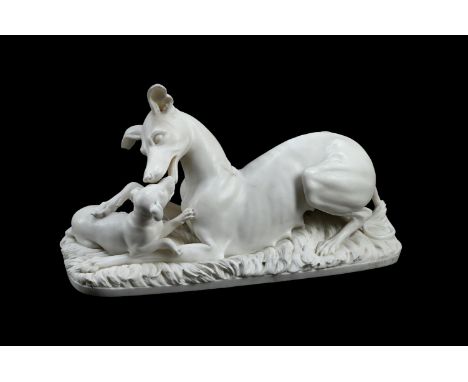 JOSEPH GOTT (1785-1860), A WHITE MARBLE GROUP OF A GREYHOUND BITCH AND PUPPY  MID 19TH CENTURY  Depicted on a grass carved ro