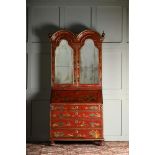 A SCARLET LACQUER AND GILT CHINOISERIE DECORATED BUREAU CABINET, IN QUEEN ANNE STYLE
