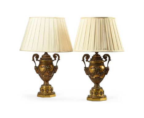 A PAIR OF NEOCLASSICAL GILT BRONZE LAMP BASES  19TH CENTURY AND LATER  Now fitted as wired lamp bases, the bases of twin hand