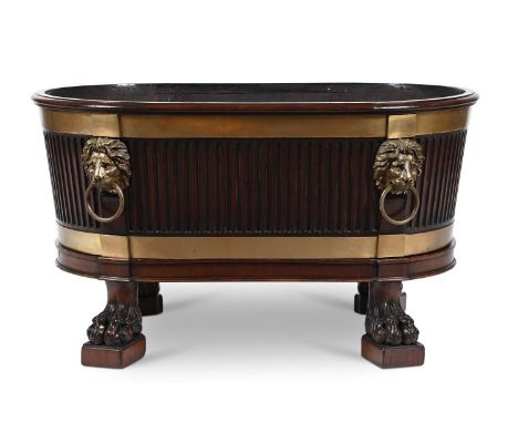 A GEORGE III MAHOGANY AND BRASS MOUNTED WINE COOLER AFTER A DESIGN BY ROBERT ADAM, CIRCA 1780 With a removable brass liner 51