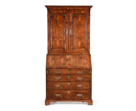 A GEORGE II WALNUT AND LINE INLAID BUREAU BOOKCASE MID 18TH CENTURY The moulded panel doors opening to a shelved interior abo