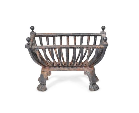 A REGENCY CAST IRON FIRE GRATE BASKET  CIRCA 1815 Cast with paw feet  45cm high, 60.5cm wide, 38cm deep  Provenance: Private 