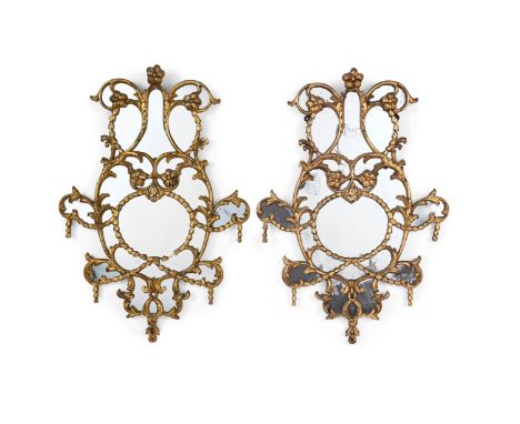 A PAIR OF CARVED GILTWOOD MIRRORS IN GEORGE III STYLE, FIRST HALF 19TH CENTURY 97.5cm high, 67.5cm wide, 5cm deepProvenance: 