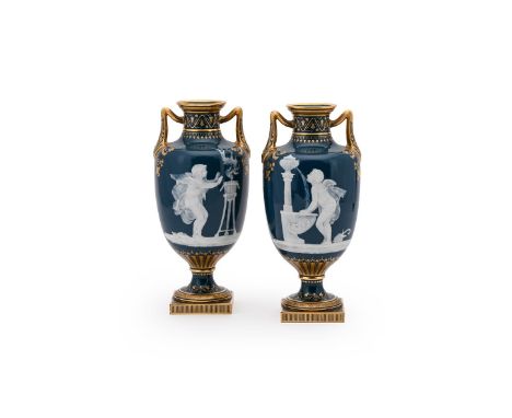 A RARE PAIR OF MINTON PÂTE SUR PÂTE TWO HANDLED VASES BY MARC-LOUIS SOLON, LATE 19TH CENTURY Each carved in white relief with