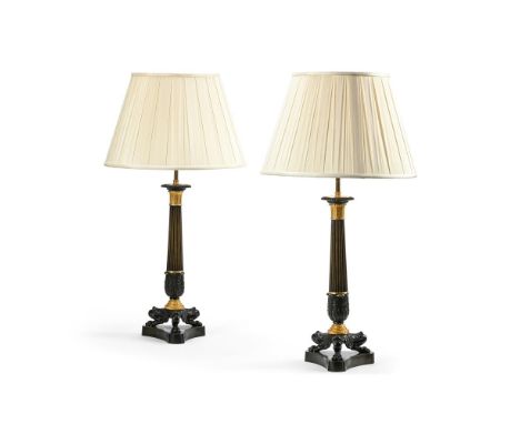 A PAIR OF FRENCH EMPIRE GILT AND PATINATED BRONZE GILT LAMP BASES  EARLY 19TH CENTURY AND LATER FITTED  Of columnar form, Her