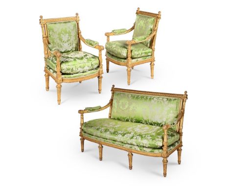 A CARVED GILTWOOD SALON SUITE COMPRISING A SETTEE AND A PAIR OF FAUTEUILS A LA REINE LAST QUARTER 19TH CENTURY, AFTER THE MOD