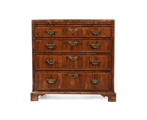 A GEORGE II WALNUT BACHELOR'S CHEST OF DRAWERS CIRCA 1740 With a caddy top and brushing slide 81cm high, 81.5cm wide, 47cm de