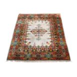 A PERSIAN SILK CARPET, approximately 314 x 240cm