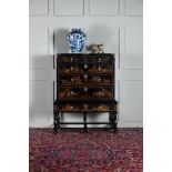 A QUEEN ANNE BLACK LACQUER AND GILT JAPANNED CHEST ON STAND, CIRCA 1710