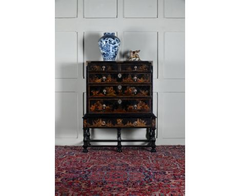 A QUEEN ANNE BLACK LACQUER AND GILT JAPANNED CHEST ON STAND IN THE MANNER OF STALKER & PARKER, CIRCA 1710 Finely decorated wi