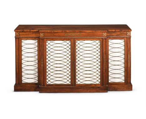Y A REGENCY ROSEWOOD AND BRASS INLAID BREAKFRONT SIDE CABINET CIRCA 1820 The brass grille and silk pleated doors opening to a