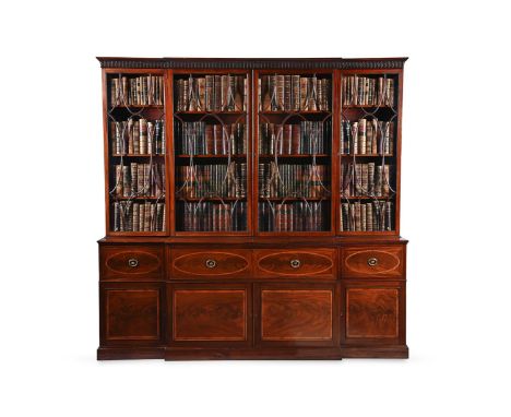 A GEORGE III MAHOGANY BREAKFRONT LIBRARY BOOKCASE ATTRIBUTED TO GILLOWS, CIRCA 1790 The lower section with three deep drawers