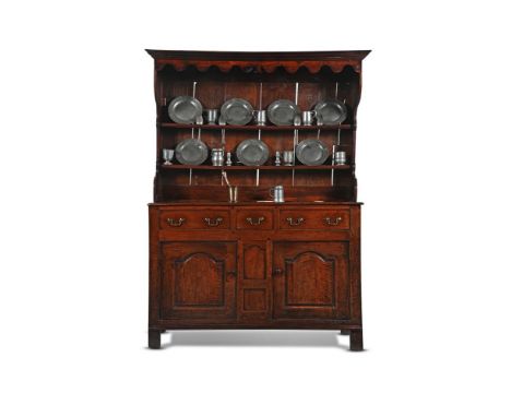 A GEORGE II OAK DRESSER BALA, NORTH WALES, MID 18TH CENTURY With a quantity of 18th and 19th century pewter and an 18th centu