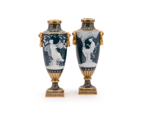 A PAIR OF MINTON PÂTE SUR PÂTE TWO HANDLED VASES BY ALBOIN BIRKS, EARLY 20TH CENTURY  Carved in low relief with scenes after 