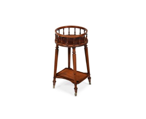 A REGENCY MAHOGANY PLATE STAND AFTER A DESIGN BY GILLOWS, CIRCA 1815 With a shaped undertier and removable brass liner 67cm h