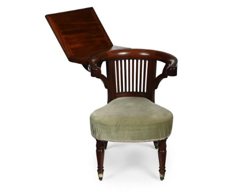 A GEORGE IV MAHOGANY LIBRARY READING CHAIR IN THE MANNER OF MORGAN & SANDERS, CIRCA 1825 The horseshoe shaped crest rail with