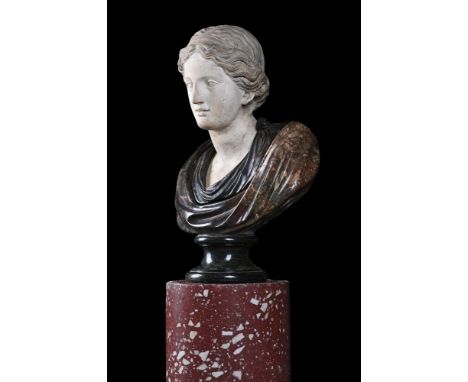 A WHITE AND MIXED MARBLE BUST OF A WOMAN ALL'ANTICA  ITALIAN, 19TH CENTURY AND POSSIBLY EARLIER  With white marble head proba