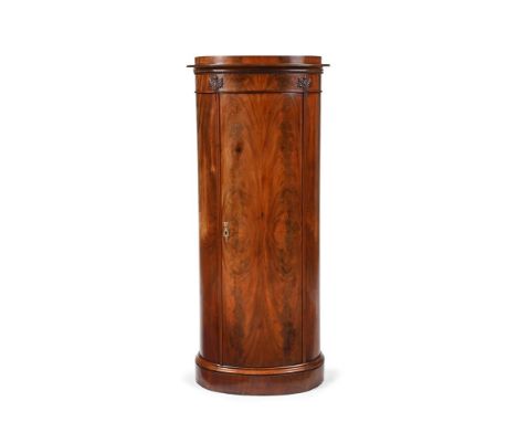 A DANISH MAHOGANY PEDESTAL CUPBOARD  EARLY 19TH CENTURY With indistinct paper label 'I HAUGSTED ... Odense' 144cm high, 64cm 