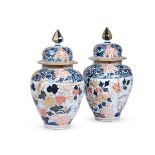 A LARGE PAIR OF IMARI STYLE JARS AND COVERS, LATE 19TH CENTURY