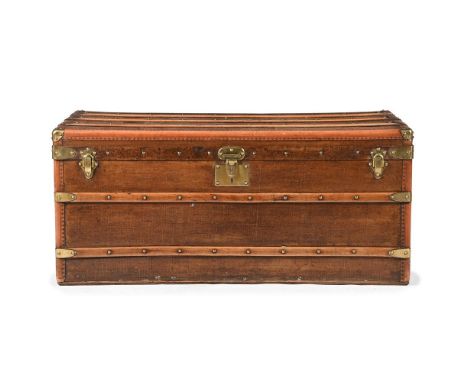 A GOYARD CANVAS, WOOD, LEATHER AND BRASS MOUNTED TRUNK LATE 19TH OR EARLY 20TH CENTURY A plaque printed to the side of the hi