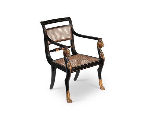 A REGENCY EBONISED AND PARCEL GILT ARMCHAIR ATTRIBUTED TO GILLOWS, CIRCA 1806-7 The back seat rail stamped 'EW' and 'III'  86