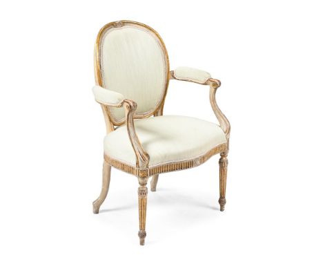 A GEORGE III PAINTED AND PARCEL GILT ARMCHAIR CIRCA 1780, IN THE MANNER OF THOMAS CHIPPENDALE Upholstered in pale rib woven f