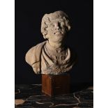 A CARVED STONE HEAD OF A WOMAN, POSSIBLY ROMANO CELTIC, 3RD CENTURY