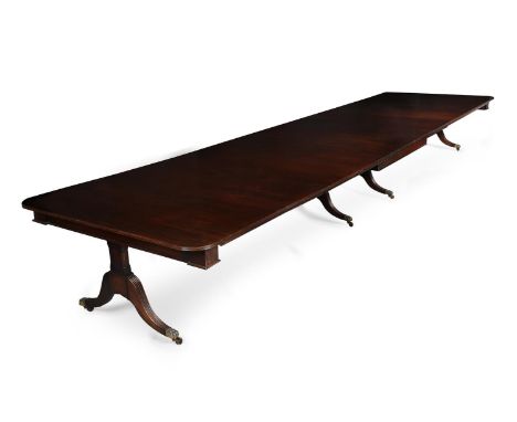 A MAHOGANY EXTENDING DINING TABLE IN THE MANNER OF DAVID EDWARDS, IN REGENCY STYLE, FIRST HALF 20TH CENTURY The extending act