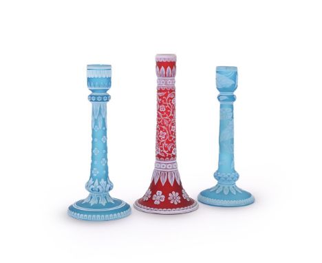 THREE SIMILAR STOURBRIDGE CAMEO GLASS CANDLESTICKS  LATE 19TH CENTURY  the tallest example 19cm high Provenance: The Estate o