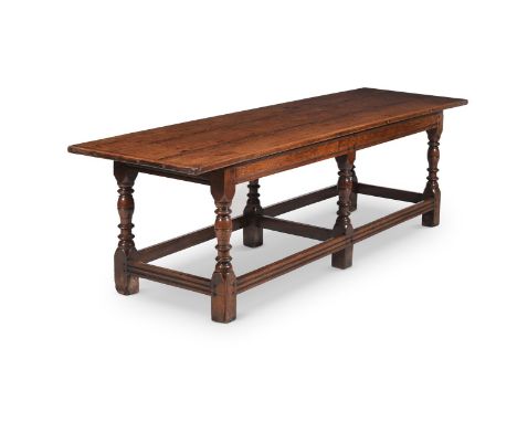 A CHARLES II OAK REFECTORY TABLE PROBABLY WELSH, CIRCA 1670 74cm high, 243cm long, 71cm wide  A closely related table sold Ch