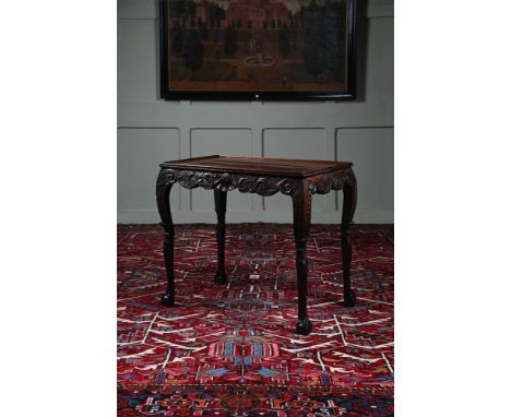 A GEORGE II IRISH SILVER OR CENTRE TABLE CIRCA 1730 73cm high, 84cm wide, 55cm deep  For two closely related tables with foli