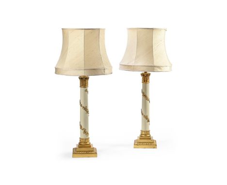 A LARGE PAIR OF GILT AND CREAM CORINTHIAN TABLE LAMPS  20TH CENTURY  Each with tall vine leaf and grape wrapped metal column,