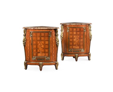 Y A PAIR OF LOUIS XV/XVI TRANSITIONAL AMARANTH, SYCAMORE, TULIPWOOD, KINGWOOD AND ORMOLU MOUNTED ENCOIGNURES  BY LÉONARD BOUD