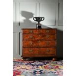 A QUEEN ANNE WALNUT AND INLAID CHEST OF DRAWERS, CIRCA 1710