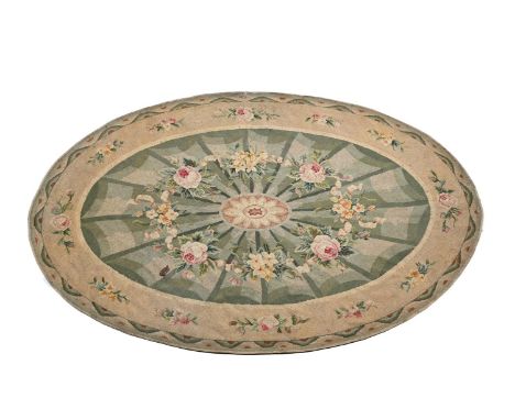 AN OVAL HAND STITCHED NEEDLEPOINT CARPET BY ARTHUR H LEE LTD., IN REGENCY STYLE, MID 20TH CENTURY approximately 256 x 165cm  